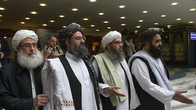 Mullah Abdul Ghani Baradar, the Taliban's top political leader, second left, arrives with other members of the militant group for talks in Moscow, Russia. AP