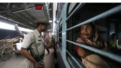 A soldier patrols the railway station in the city of Guwahati in north-east India yesterday as security was stepped up across the country following a string of bomb blasts in Mumbai on Wednesday that killed 17 people and left more than 130 injured. Anupam Nath / AP Photo