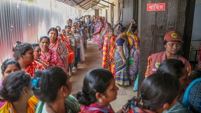 Voters queue outside a polling centre at a high school in Dhaka. EPA