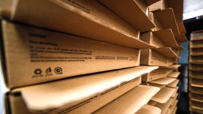 The boxes are then loaded onto delivery trucks.