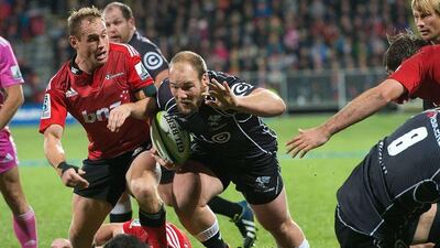 Coastal Sharks' Kyle Cooper runs in the winning try on Saturday against Canterbury Crusaders. Marty Melville / AFP / May 17, 2014