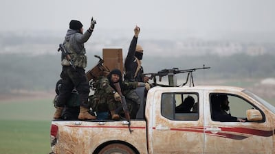 Members of al Qaeda's Nusra Front gesture after seizing territory in the southern countryside of Idlib December 2014. REUTERS/Khalil Ashawi