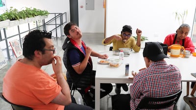 Artists take a break in the upper level of the studio. Pawan Singh / The National