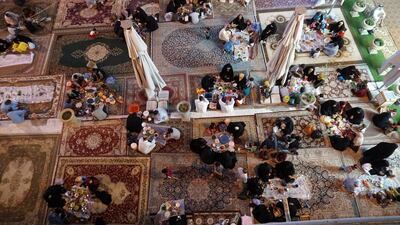 Iraqi families break their daily fast after staying away from food and water from sunrise to sunset during the month Ramadan, in Hilla, Iraq. Reuters