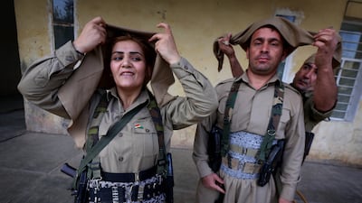 Iranian Kurdish Peshmerga members of the Kurdistan Democratic Party get ready during routine military exercises in Koya, 100km north of Arbil, the capital of the autonomous Kurdish region of northern Iraq. AFP