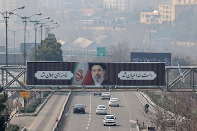 A billboard of Iran's new supreme leader Ayatollah Mojtaba Khamenei towers over a motorway in Tehran. AFP