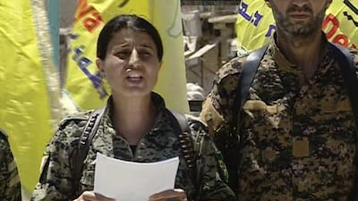 Syrian Democratic Forces spokeswoman Jihan Sheikh Ahmed reads out a statement by the US-backed alliance in the northern town of Tabqa on May 12, 2017. Syrian Democratic Forces via AP
