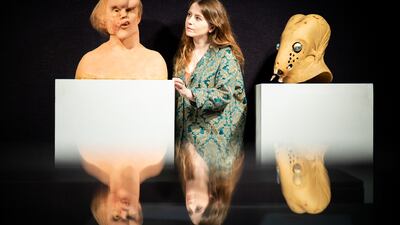 Two lots in Bonhams' The Uncanny sale in London, which includes items from film and theatre: left, an original production reference bust of John Merrick from The Elephant Man (estimate £6,000-£8,000) and a second stage Guild Navigator head (estimate (£1,500-£2,000) made for Dune. Getty Images