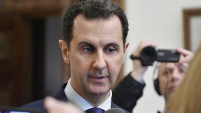 Syrian President Bashar Assad speaks with French journalists in Damascus. (SANA via AP))