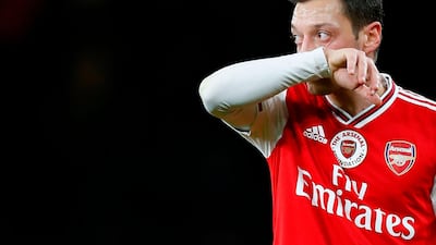 Arsenal's German midfielder Mesut Ozil prepares to take a freekick against Manchester City at the Emirates Stadium. AFP
