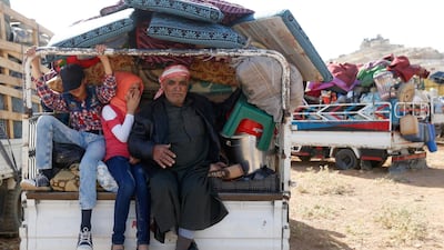 Syrian refugees prepare to return to Syria from the Lebanese border town of Arsal, Lebanon, on June 28, 2018. Mohamed Azakir / Reuters