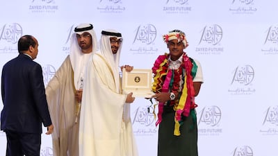 Sheikh Mohammed bin Zayed presents an award to Motufoua Secondary School (Oceania) at the Zayed Future Energy Prize awards ceremony as part of Abu Dhabi Sustainability Week. Chris Whiteoak / The National