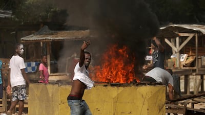 Residents protest after ransacking a half-built makeshift hospital, as they say its location is too close to a local community, in Yopougon, Abidjan, Ivory Coast. Reuters