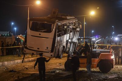 A tourist bus which was attacked being towed away from the scene in the Giza province. AFP