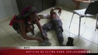 An injured man lies on the floor of a hospital, following explosions at a military base, according to local media, in Bata, Equatorial Guinea. Reuters