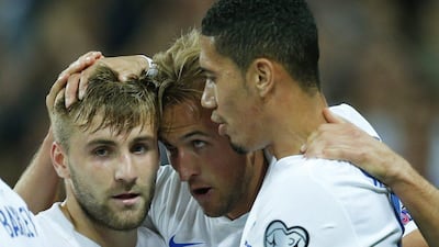 Manchester United defenders Luke Shaw, left, and Chris Smalling, right, with Harry Kane during England's win over Switzerland in Euro 2016 qualifying on Tuesday night. Eddie Keogh / Reuters / August 8, 2015