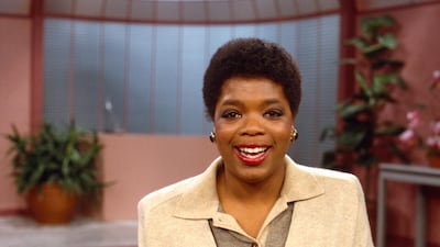 Oprah Winfrey wears layered neutral knitwear and statement earrings to host 'AM Chicago' in 1984. Getty Images