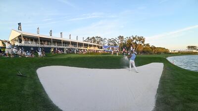 Tony Finau hits out of the sand at the 18th. USA Today