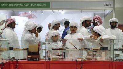 Visitors attend the first day of Adihex. Pawan Singh / The National