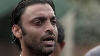 Shoaib Akhtar pauses during bowling at the Pakistan Cricket Academy sports ground in Lahore, Pakistan, on July 19, 2008.
