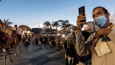 Expo visitors try to make memories of an extraordinary day.