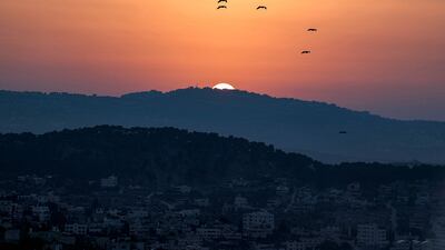The sun sets after a violent day. AFP