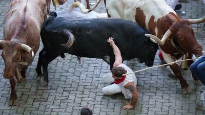A participant hits the ground during the running of the bull at the San Fermin festival in Pamplona, northern Spain. AFP