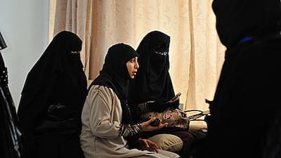 Students campaigning for women to be allowed to wear the niqab in class and at exams protest in the administration building at the College of Arts and Humanities at Manouba University on Tuesday.