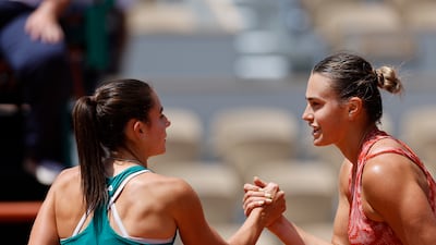Aryna Sabalenka of Belarus, right, and Emma Navarro of the US shake hands after their match. AP