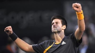 Novak Djokovic roars his delight after beating Gael Monfils in the final of the Paris Masters.
