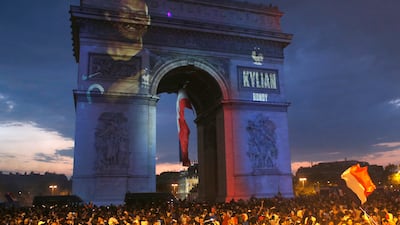 The image of Kylian Mbappe is projected onto the Arc de Triomphe after France won the 2018 World Cup. AP