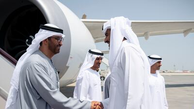 Sheikh Tamim, Emir of Qatar, receives Dr Sultan Al Jaber, Minister of Industry and Advanced Technology, Group Chief Executive of Adnoc and Chairman of Masdar, at Doha International Airport. Abdulla Al Bedwawi / UAE Presidential Court