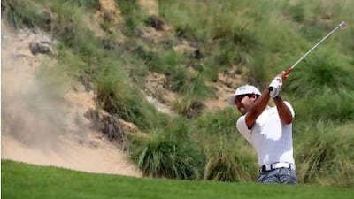 Saif Thabet plays a round of golf at the Yas Links Golf Club to qualify for the Nomura Cup last month.