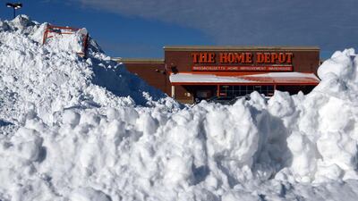 Snow is piled up high in front of Home Depot in the South Bay shopping center after a two day winter storm in Boston, Massachusetts. Darren McCollester/Getty Images/AFP