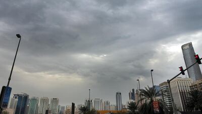 Thick clouds hover over buildings along Airport Road in Abu Dhabi on Tuesday. Delores Johnson / The National