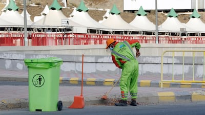 A Bengali worker cleans the streets in Mina.