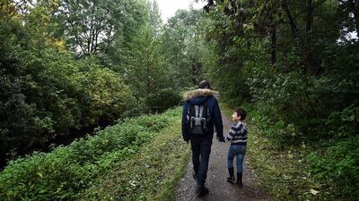 Wael takes a walk with his son Ali outside the registration office where he already spent more than four hours to register his wife in Hamburg. After spending almost the entire day at the registration office, the family was told they had to return the following week to start the whole procedure over. Astrid Riecken / Getty Images