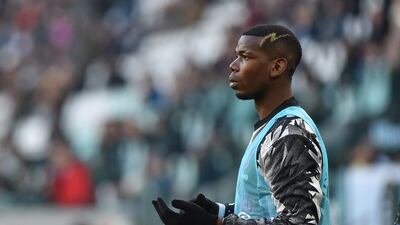Juventus substitute Paul Pogba warms up during the match. Reuters