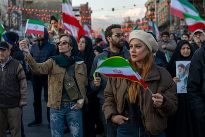 Iranians mourn the crew members of a vessel sunk by a US submarine. Getty Images