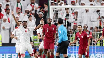 UAE players claim hand ball during their Asian Cup semi-final.