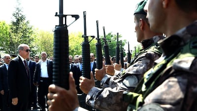 Turkish president Recep Tayyip Erdogan, left, reviews special police forces' at their headquarters in Ankara on July 29, 2016. Kayhan Ozer Presidential Press Service, via AP, Pool