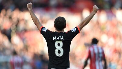 Juan Mata celebrates scoring the third goal for Manchester United. Tony O’Brien / Reuters
