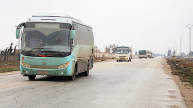 American buses with ISIS fighters from the Syrian Democratic Forces head from Syria to Iraq, in Qamishli, Syria. Reuters