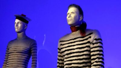 A manequin with the facial features of French fashion designer Jean Paul Gaultier projected onto it is displayed during an exhibition devoted to Gaultier’s work on March 30, 2015 in Paris. Patrick Kovarik / AFP photo