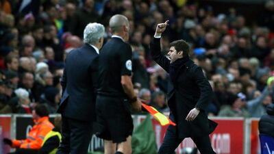 Tottenham Hotspur manager Mauricio Pochettino, right, celebrates during his side’s match against Stoke. Nigel Roddis / EPA