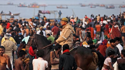 Hindu devotees crowd the confluence of the Ganges and Yamuna rivers to take a ritualistic bath during Makar Sankranti in Prayagraj. AP