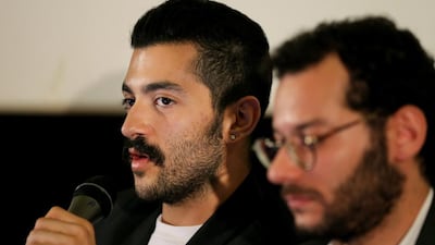 Lebanese Hamed Sinno, left, the lead singer and song writer of the Lebanese group Mashrou' Leila. A Jordanian ban on the group performing in the country was lifted, but not in time for the group to travel to the concert. Hussein Malla / AP Photo
