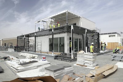 Team members of Sharjah University constructing their solar powered, energy efficient home. Pawan Singh / The National