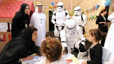 Twofour54 CEO Noura Al Kaabi and three Star Wars Stormtroopers paid a visit to children at Sheikh Khalifa Medical City in Abu Dhabi. Courtesy of twofour54
