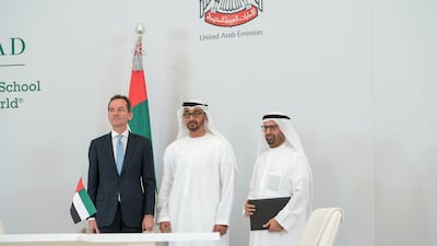 Sheikh Mohammed bin Zayed, Crown Prince of Abu Dhabi and Deputy Supreme Commander of the UAE Armed Forces, centre, is pictured after an MOU signing, during a Sea Palace barza. It was seen on behalf of the department of Education and Knowledge, Dr Ali Rashid Al Nuaimi, Director General of Abu Dhabi Education Council and Abu Dhabi Executive Council Member, right, and on behalf of INSEAD, Dr Andreas Jacobs, Chairman of INSEAD. Mohamed Al Hammadi / Crown Prince Court - Abu Dhabi
